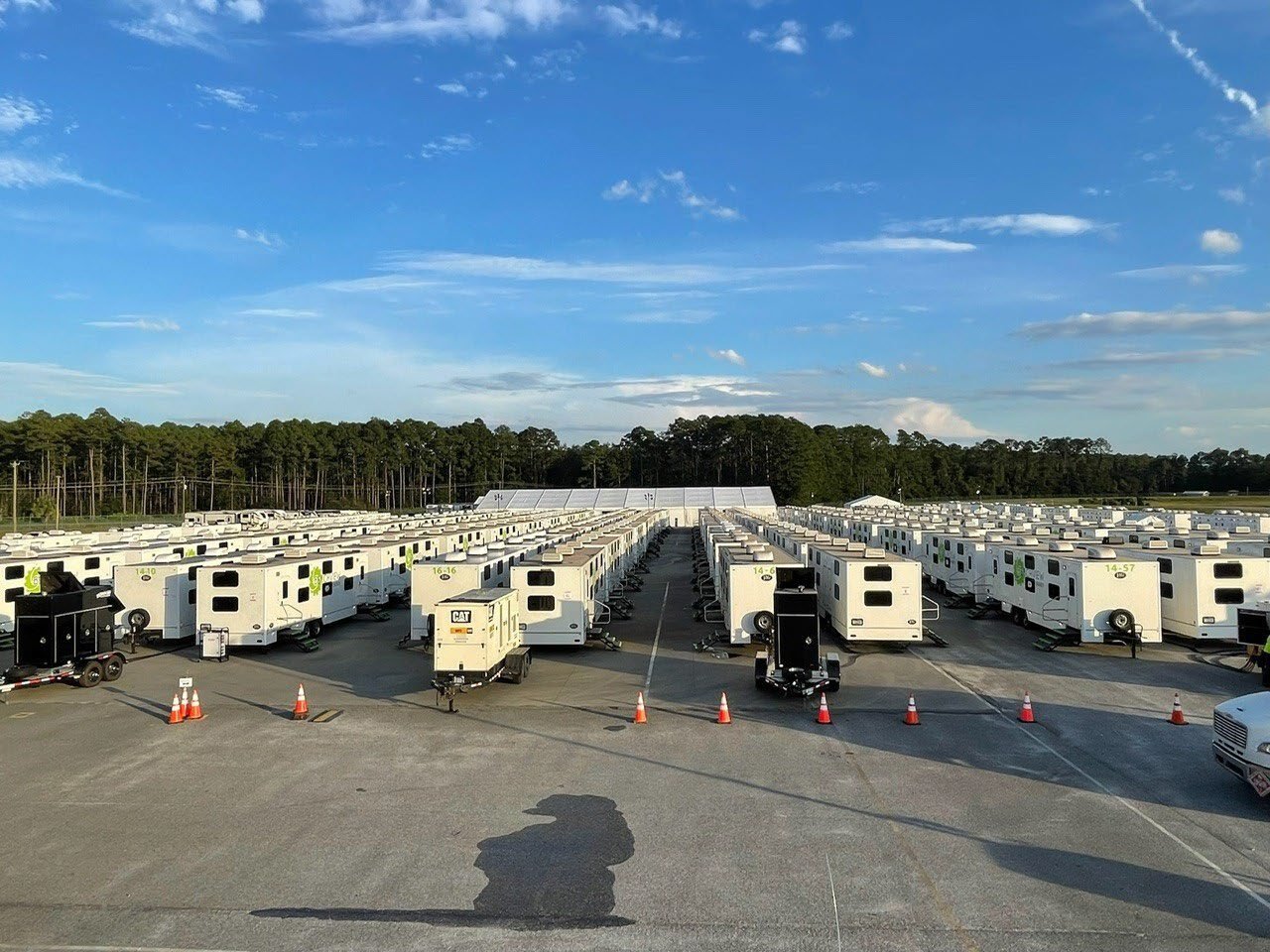 Rows of workforce housing units arranged in an organized camp.